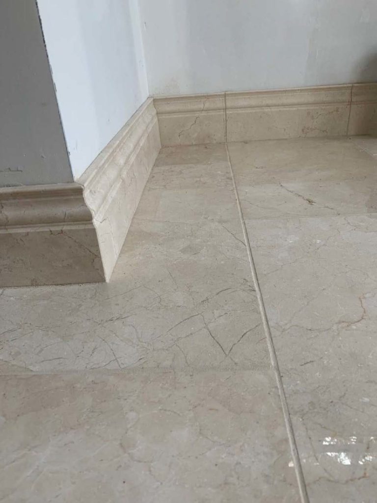 Tile Floor & Baseboard in Foyer